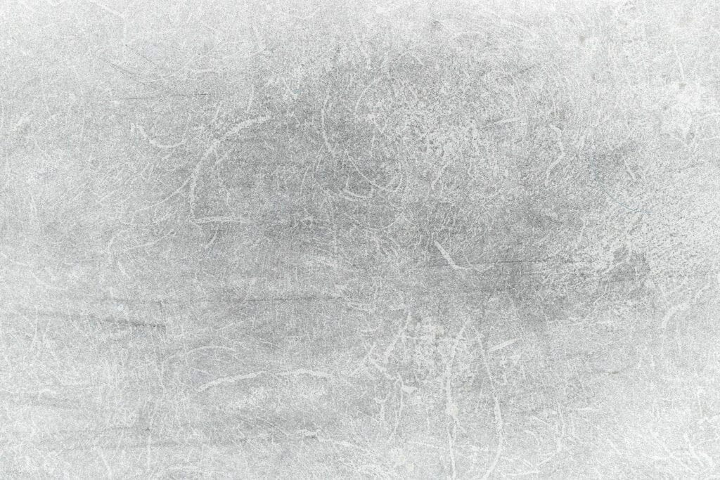 Rough scratched concrete surface in gray